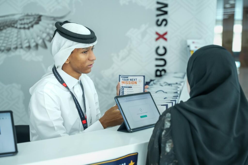 Prospective student speaking with the Barzan University College team during an Open Day in Doha, Qatar.