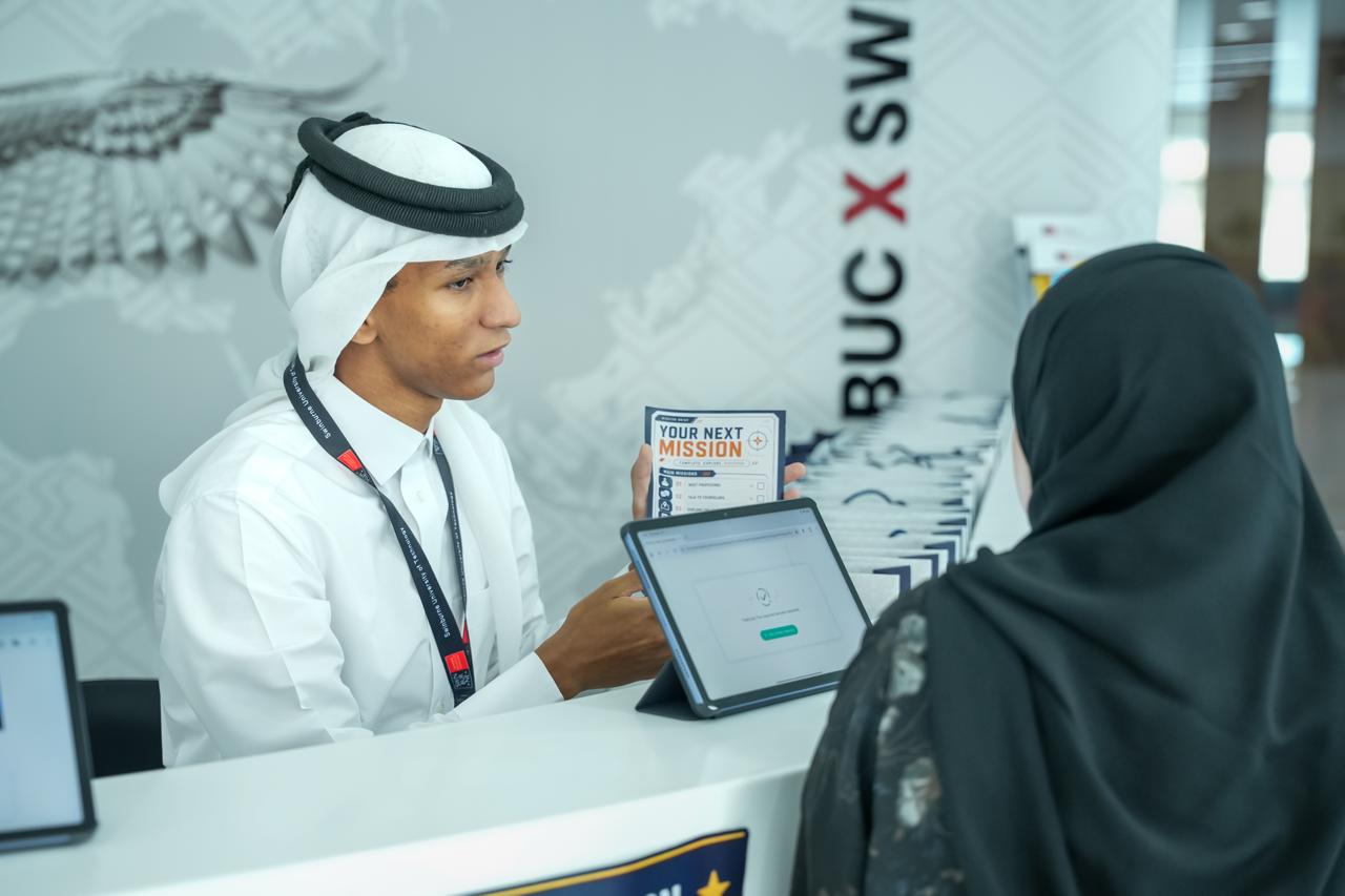 Prospective student speaking with the Barzan University College team during an Open Day in Doha, Qatar.